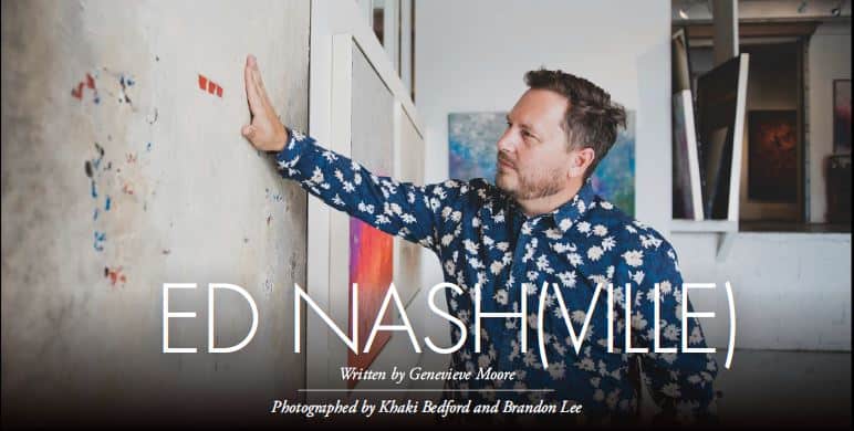 Picture of artist, Nash, looking at the art in the office of Brian Biesman