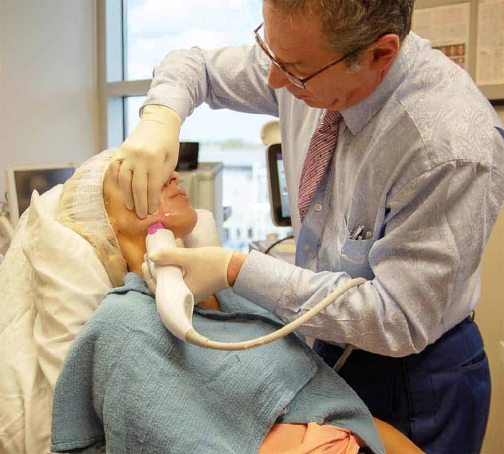 Dr. Biesman performing non-surgical skin rejuvenation on a patient in Nashville